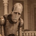 Marvin: a long, gaunt metal face, looking glum.