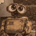 WALL-E: two binocular eyes on a boxy, weathered body.